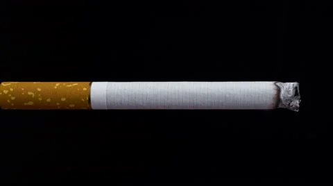 Cigarette on a black background, lighter and smoke Video stock 55241674
