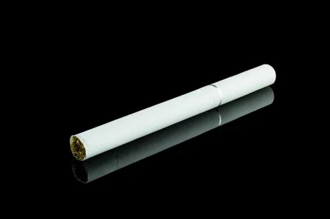 Cigarette on black background Stock Photos