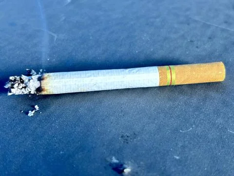 Cigarette black background Stock Photos