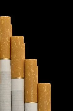 Cigarette on black close up Stock Photos
