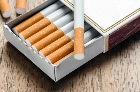 Cigarette in the box of matches Stock Photos
