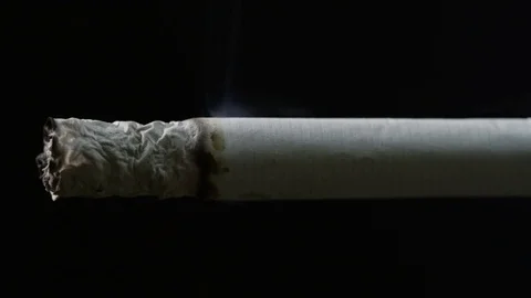 Cigarette burning and bending on black Video stock 84017841