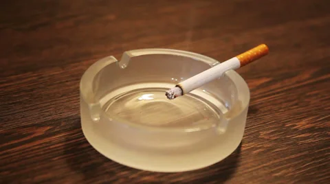 Cigarette burning and falling Stock Footage 34254208