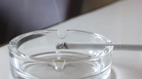 Cigarette burning in ashtray Video stock 45697208