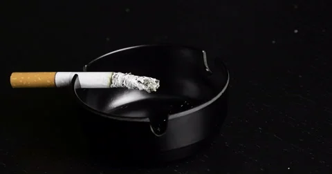 Cigarette burning in ashtray time lapse Stock Footage 57636348