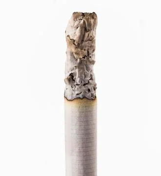 Cigarette butt burning on white macro Stock Photos