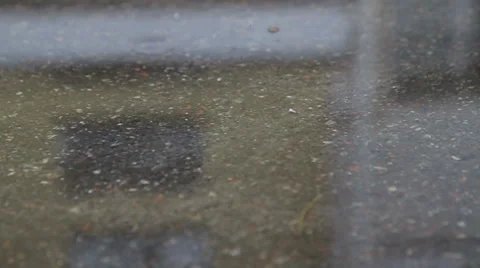 Cigarette butt falls into the puddle Stock Footage 61437083