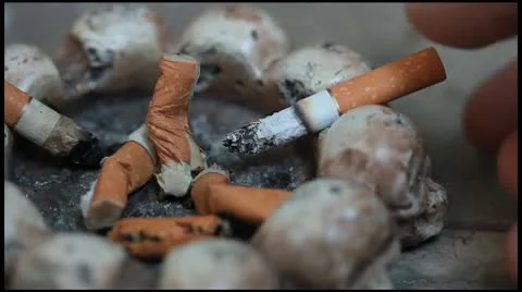 Cigarette butts in the ashtray Stock Footage 8963963