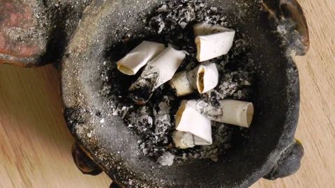 Cigarette butts in the ashtray Stock Footage 94666700