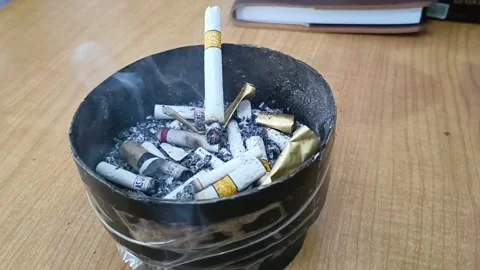Cigarette butts in the ashtray Stock Footage 277267235