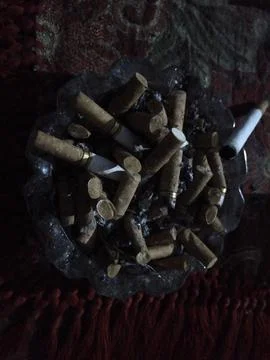 Cigarette butts in the ashtray Stock Photos