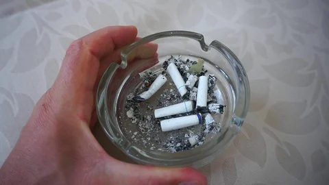 Cigarette butts extinguished into cigarette ashtray, 库存影片 114984892