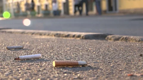 Cigarette butts on the pavement Video stock 55268312