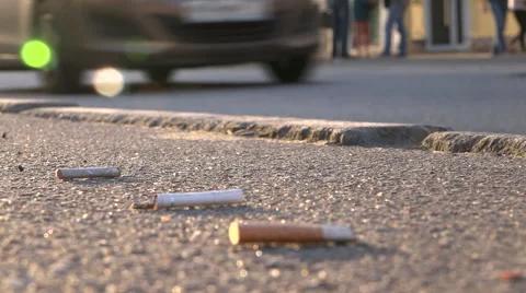 Cigarette butts on the pavement Video stock 55272795