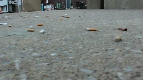 Cigarette Butts On The Sidewalk By The Riverside Stock Footage 40971889