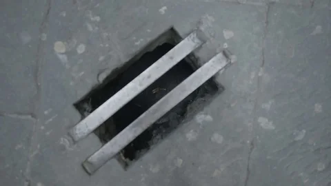 Cigarette Butts in Street Drain - 29,97FPS NTSC Stock Footage