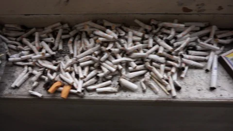 Cigarette butts on the windowsill Stock-Footage 121724101