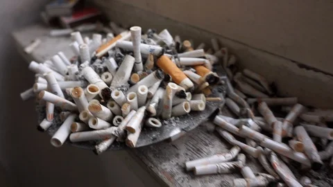 Cigarette butts on the windowsill Stock Footage 121724127