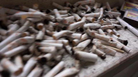 Cigarette butts on the windowsill Vídeo Stock 121727595