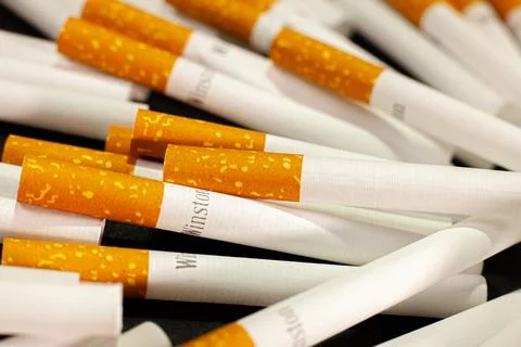 Cigarette case with filter. Adversely affects health. Illegal transaction. Stock Photos