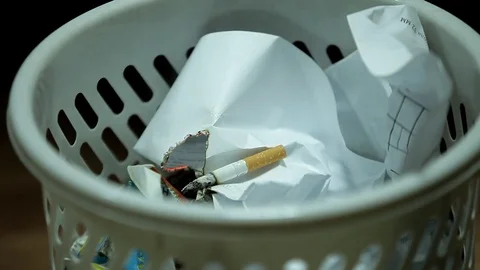 Cigarette causing a fire Stock Footage 78726473