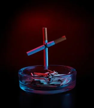 Cigarette cross on ashtray Stock Photos
