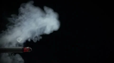 Cigarette with exhaled smoke brooding in the air