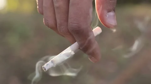 Cigarette in hand Stock Footage 55704317