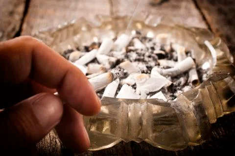 Cigarette in hand Stock Photos