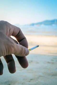 Cigarette in hand 스톡 사진