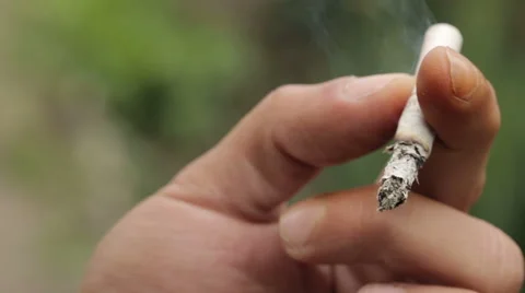 Cigarette in the Hands of a Smoker Stock Footage 53073213