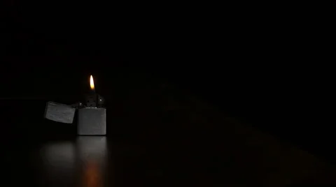 Cigarette lighter on a black background Stock Footage 48000437