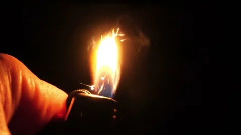Cigarette lighter lighting flame slow motion Stock Footage 92304106
