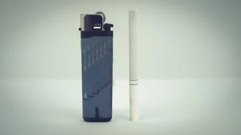 Cigarette with a lighter on a white background Stock Photos