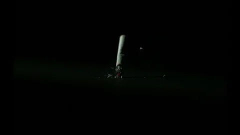 Lit cigarette falling on the floor with ... | Stock Video