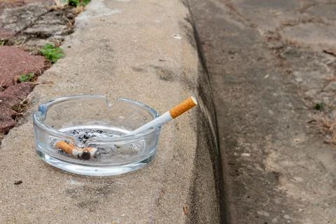Cigarette outside put view trash texture grey Stock Photos