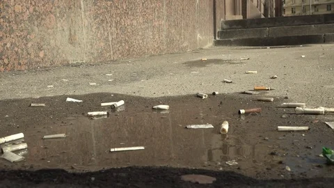 Cigarette on the pavement. Video stock 74631245
