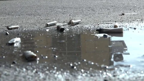 Cigarette on the pavement. Video stock 74632418