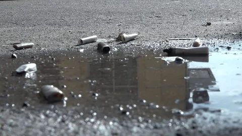 Cigarette on the pavement. Video stock 74632420