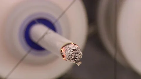 Cigarette puffing in laboratory testing equipment
