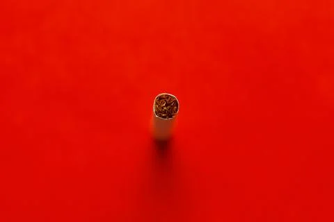 Cigarette on red background Stock Photos
