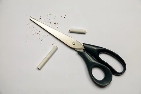 Cigarette in scissors. Bad habit. Stock Photos
