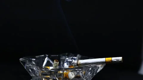 Cigarette smoke on a black background Stock Footage 223191571
