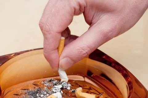 Cigarette stubbing out Stock Photos