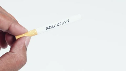A cigarette with written word Addiction Stock Footage 248717302