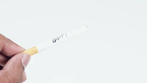 A cigarette with written words Quit! Stock Footage 248716850