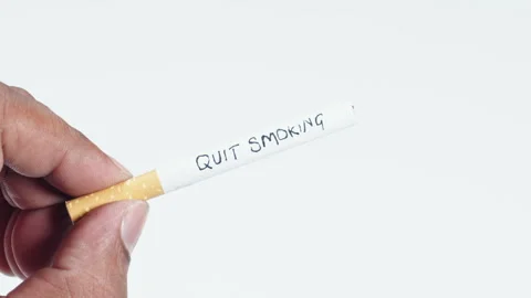 A cigarette with written words Quit smoking Stock Footage 248717812