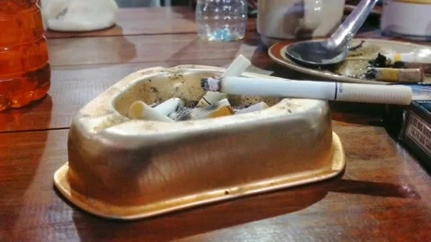 Cigarettes and ashtrays, two things that can not be far from a smoker Stock Footage 243345161