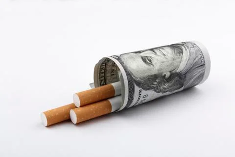 Cigarettes and a US dallar note. smoking concept. Stock-Fotos