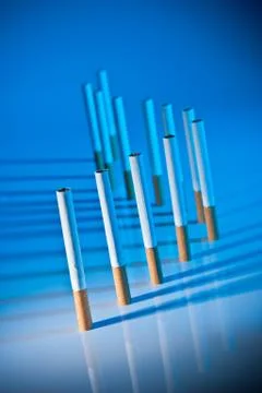 Cigarettes on bright blue background Foto stock